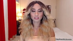Asain blonde TS wanks cock in chair in front of webcam Thumb