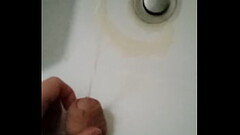 Student with a big fat cock pissing in the sink in a public toilet Thumb